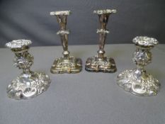 EPNS/WHITE METAL CANDLESTICKS, two pairs, all with removable sconces and floral embossed detail,