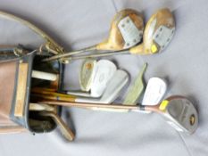 VINTAGE GOLF CLUBS IN CARRY CASE including two wooden shafted examples, one marked 'The Uot Putter'
