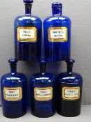FIVE LARGE BRISTOL BLUE GLASS APOTHECARY BOTTLES bearing mercurial type glass labels, 32cm heights