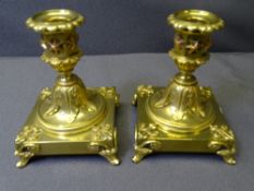 VICTORIAN GILT BRASS CANDLESTICKS, a pair, with removable sconces, leaf and applied copper star stem