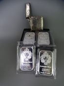 FOUR SCOTTSDALE SILVER ONE TROY OZ INGOTS & A VESTA CASE, Birmingham 1906 with chased decorated