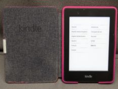 KINDLE - hand held in pink case