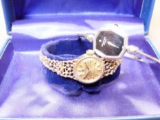 TISSOT 9CT GOLD LADY'S BRACELET WRIST WATCH, 13grms gross and a Raymond Weil white metal bangle