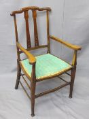 EDWARDIAN MAHOGANY ARMCHAIR having slight Art Nouveau detail and upholstered seat, 97cms H, 58cms
