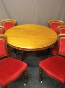 VICTORIAN MAHOGANY TILT DINING TABLE and set of six upholstered and mahogany chairs, 73cms H, 121cms