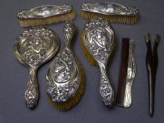 ART NOUVEAU SILVER DRESSING TABLE SET (7 ITEMS) including hand mirror and four brushes, Birmingham