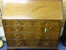 GEORGIAN MAHOGANY FALL-FRONT BUREAU, circa 1820, the well fitted interior with Sheraton type ovals