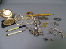 HEAVY LINK SILVER CHARM BRACELET with padlock clasp holding 23 charms, 117grms gross, a white