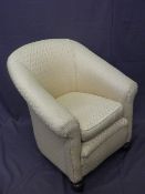 VINTAGE RE-UPHOLSTERED ARMCHAIR on front bun feet and brass castors, 80cms H, 74cms W, 50cms seat