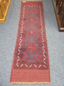 MESHWANI RUNNER - red ground, triple bordered with a repeating diamond central pattern, 240 x 60cms
