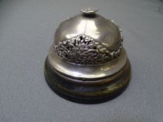 VICTORIAN SILVER WIND-UP DESK BELL with pierced floral decoration on an ebonized wooden base, London