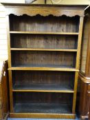 REPRODUCTION OAK OPEN BOOKCASE with shaped top frieze, 197cms H, 132cms max W, 32cms D