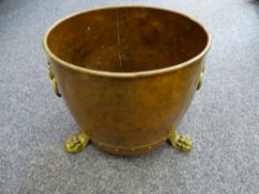 COPPER COAL SCUTTLE with brass paw feet and lion ring handles, 40cms D