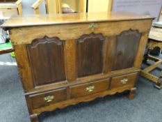 ANTIQUE LANCASHIRE CHEST, base of three deep drawers, three fielded panels, hinging lid, brass