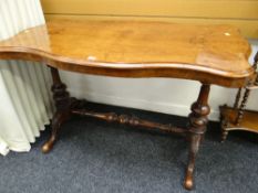 ANTIQUE WALNUT SIDE TABLE having carved feet and stretcher, shaped top, 71cms H x 65cms D x 122cms