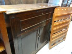 VINTAGE NARROW OAK TWO DOOR CUPBOARD with a pull-down top, together with a shelving unit