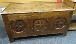 ANTIQUE OAK COFFER CHEST with three carved panels to the facade, hinging open to reveal internal