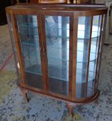 VINTAGE BOW-FRONT MAHOGANY TWO DOOR STANDING DISPLAY CABINET, 116cms H x 32cms D x 106cms L