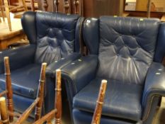 PAIR OF BLUE LEATHER BUTTONED WING-BACK ARMCHAIRS
