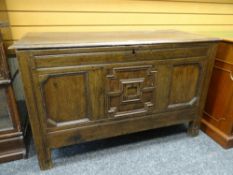 ANTIQUE OAK COFFER CHEST with carved and panelled facade, 78cms H x 56cms D x 127cms L