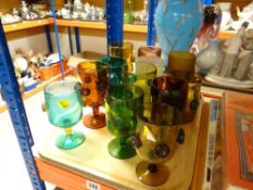 MID 20TH CENTURY SELECTION OF IRANIAN COLOURED HAND-MADE GLASS to include two tankards and ten