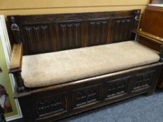 GOOD GOTHIC-TYPE OAK BOX-SEAT SETTLE carved with ecclesiastical-type panels and figures, 140cms