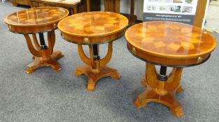 TRIO OF REPRODUCTION CIRCULAR LAMP TABLES on shaped bases with bow supports, 67cms H x 71cms diam