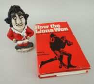 JOHN HUGHES GROGG POTTERY CARICATURE OF GARETH EDWARDS standing in full Welsh rugby union kit upon