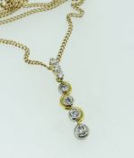 18CT YELLOW GOLD DIAMOND DROP PENDANT SET WITH GRADUATED DIAMONDS, on a 9ct yellow gold chain, 8.6