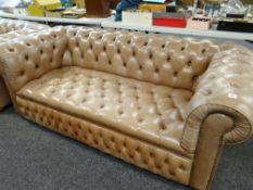 TAUPE COLOURED THREE-SEATER CHESTERFIELD-TYPE SETTEE