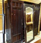 VINTAGE LINEN-FOLD BREAK-FRONT WARDROBE, centre mirror-door opening to linen drawers, flanking