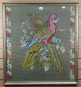 BERLIN-WORK PANEL DEPICTING A PARROT flanked by chains of flowers, 77 x 71cms (including frame)