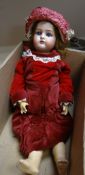 VINTAGE PORCELAIN HEAD DOLL in a red velvet dress and with matching hat
