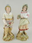 PAIR OF HEUBACH BISQUE FIGURES modelled as a fisher boy and girl companion, 42cms high