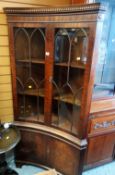REPRODUCTION MAHOGANY CONCAVE STANDING CORNER CUPBOARD with astragal glazed top and two door