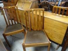 MID-CENTURY TEAK DROP-LEAF DINING TABLE with set of four matching cushion seat high back dining