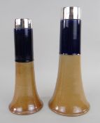 TWO SIMILAR ROYAL DOULTON TWO-TONE STONEWARE TAPERING VASES, both having silver collars, impressed