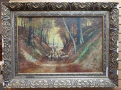 J LARION oil on canvas - shepherd and flock in woodland, signed, 57 x 87cms