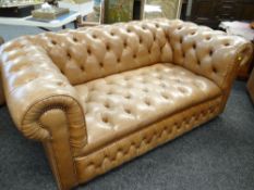 TAUPE COLOURED TWO-SEATER CHESTERFIELD-TYPE SETTEE