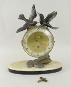 FRENCH DECORATIVE MANTEL CLOCK on oval marble base, spelter mounted with two doves to the top,