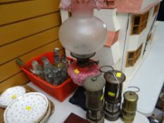THREE REPRODUCTION MINER'S LAMPS, collection of mainly local bottles and a coloured glass oil lamp