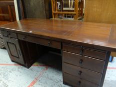 MODERN OAK OFFICE-STYLE DESK with centre drawer flanked by cupboard and drawers, 78cms H x 77cms D x