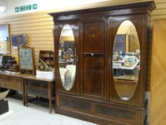 EDWARDIAN MAHOGANY STRING INLAID BEDROOM SUITE comprising one triple wardrobe with