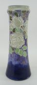 ROYAL DOULTON STONEWARE TAPERING VASE overall decorated with tube lined floral decoration by Florrie