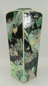 FAMILLE NOIR SQUARE BASED TAPERING VASE decorated with four battle scene panels, (damage - missing
