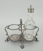 SILVER CONDIMENT BOTTLE STAND of shaped form with loop handle and pad feet, Sheffield 1899, 9.2oz (