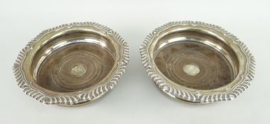 PAIR OF SILVER BOTTLE COASTERS with turned wooden bases, Sheffield 1850, TJNC
