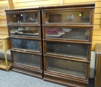 PAIR OF P E GANE LIMITED FOUR SECTION STACKABLE LIBRARY BOOKCASES in dark stained wood, bearing