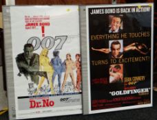 TWO JAMES BOND 007 REPRODUCTION POSTERS in frames 'Dr. No' and 'Goldfinger'
