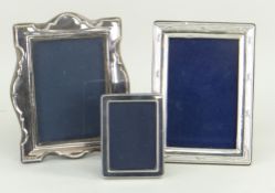 THREE SILVER PORTRAIT PHOTOGRAPH FRAMES, one small, two medium (3)